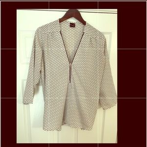 Zip-up quarter length polka dot blouse
